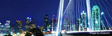 JPEG image of section of a nighttime photo of a Calatrava bridge, the Margaret Hill Bridge, in front of the Dallas skyline by emerzon, courtesy of Flickr Creative Commons. Link: https://www.flickr.com/photos/emerzon/14806229162/in/photolist-oynN69-aSUu7F-6Wv5aj